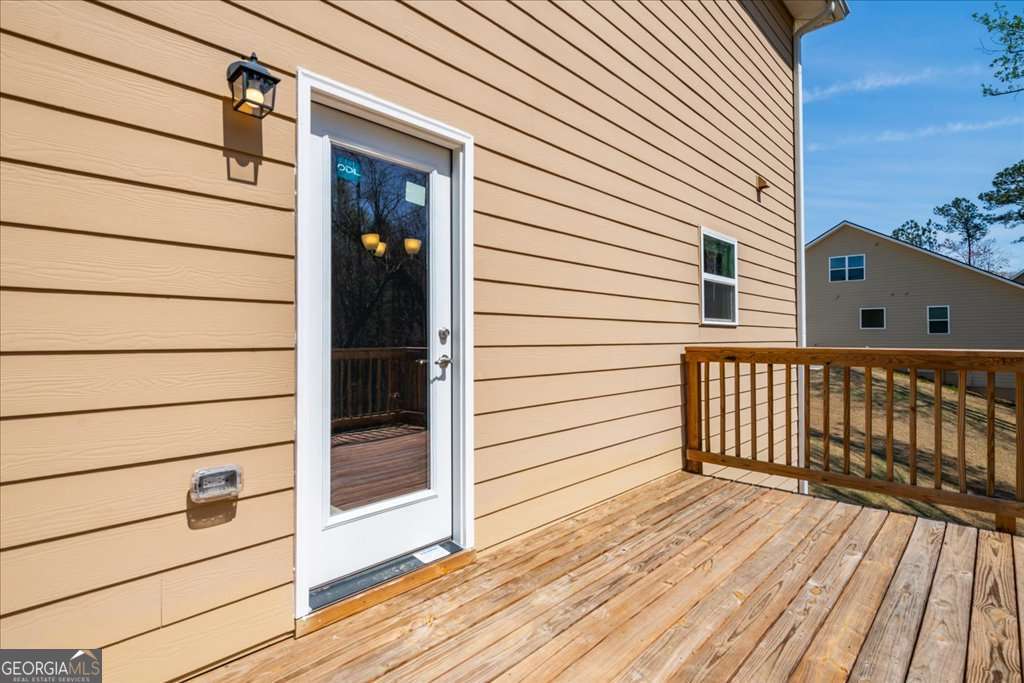 219 Carsons Walk Macon, GA 31206 - Photo 54 of 57 a view of a balcony with wooden floor and fence