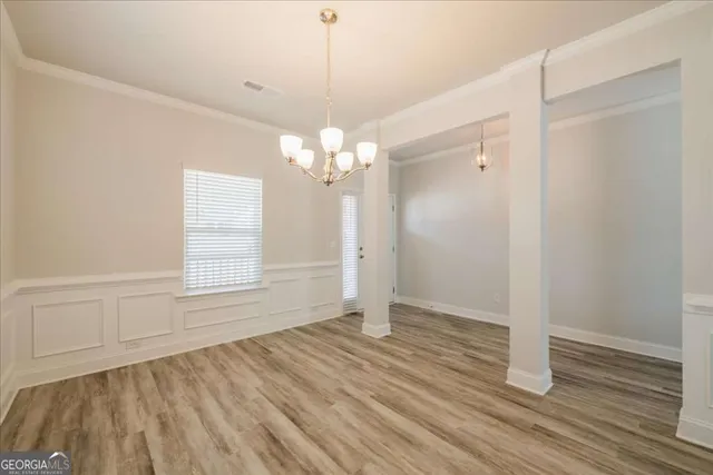 an empty room with wooden floor
