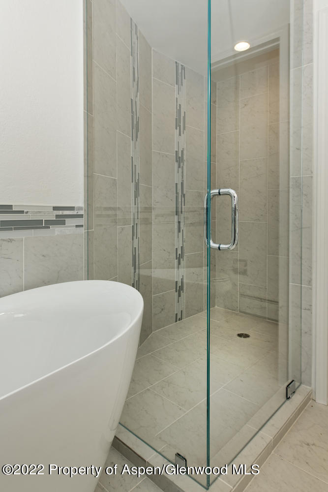 19 Pine Ridge Road Basalt, CO 81621 - Photo 12 of 16 a bathroom with a bathtub and shower