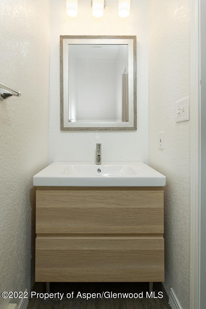 19 Pine Ridge Road Basalt, CO 81621 - Photo 6 of 16 a bathroom with a sink vanity and a mirror