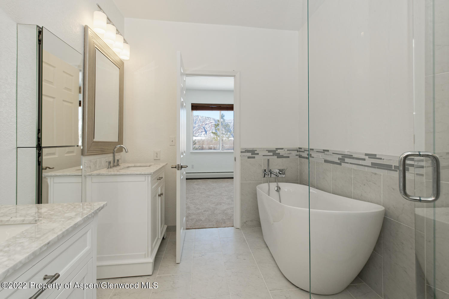 19 Pine Ridge Road Basalt, CO 81621 - Photo 8 of 16 a bathroom with a tub sink and mirror