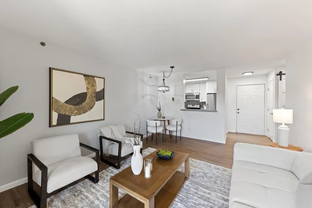 a living room with furniture and a table