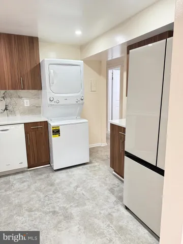 a kitchen with stainless steel appliances a refrigerator and a stove