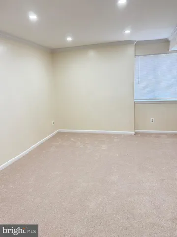 an empty room with wooden floor