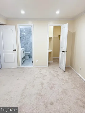 an empty room with a bathroom