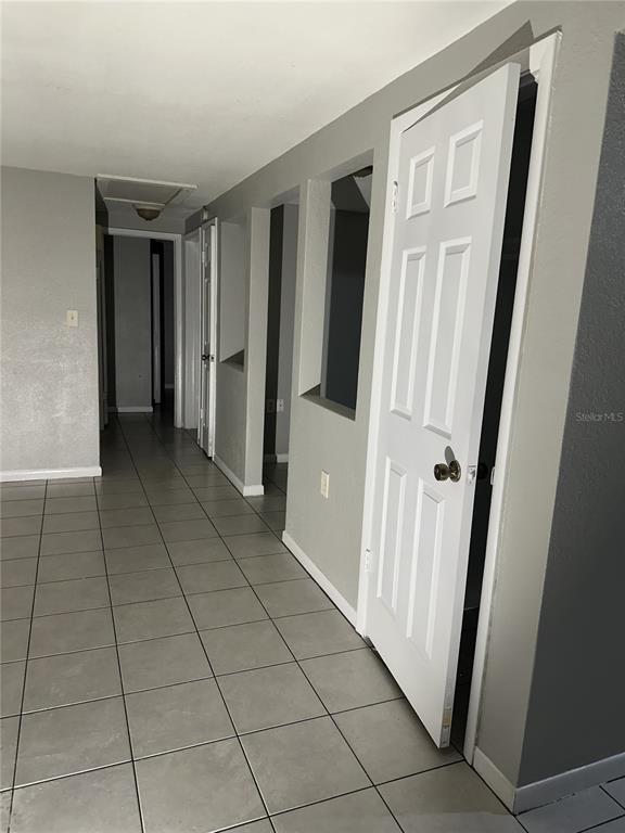 5509 Riddle Road Holiday, FL 34690 - Photo 4 of 13 a view of a hallway to rooms and stairs