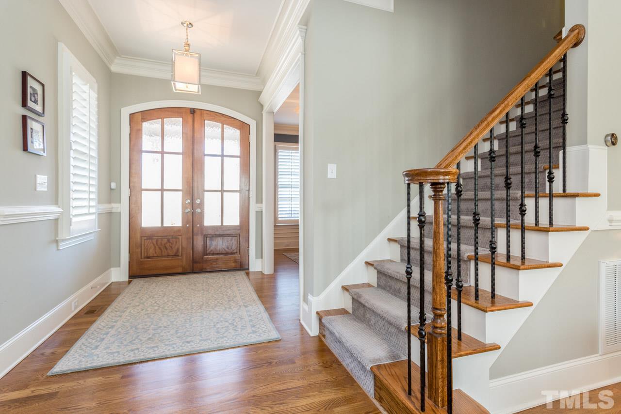 5012 Pomfret Point Raleigh, NC 27612 - Photo 2 of 25 As you enter the home you will notice the extensive crown molding and the gleaming hardwood floors. The side-load staircase to the 2nd floor features wrought iron spindles and a beautiful runner on the hardwood treads of the staircase.