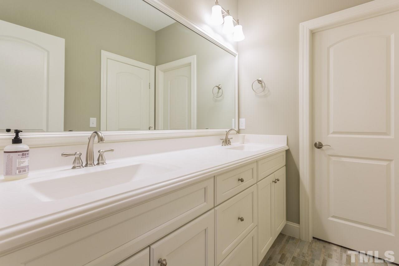 5012 Pomfret Point Raleigh, NC 27612 - Photo 14 of 25 This well-planned bath features double rectangular sinks, a framed mirror, and a door that separates the bath and toilet room from the vanity area. This great layout allows 2 people to use the bath at the same time!