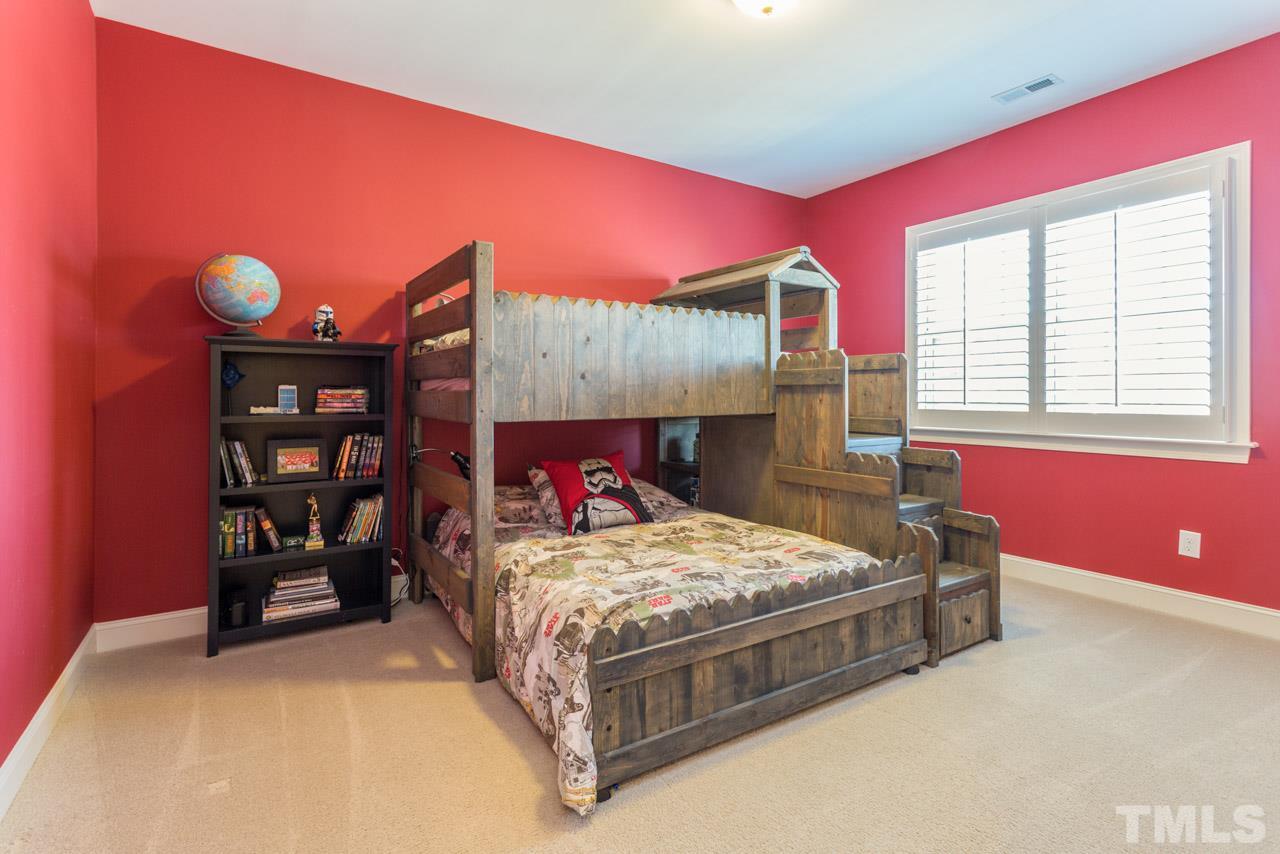 5012 Pomfret Point Raleigh, NC 27612 - Photo 15 of 25 Bedroom #3 features a large closet and planation blinds.