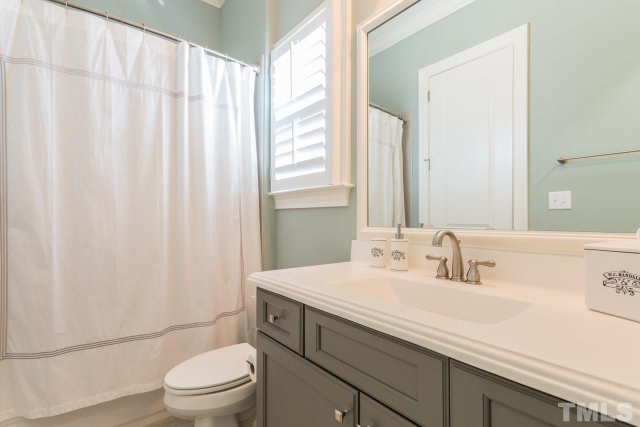 5012 Pomfret Point Raleigh, NC 27612 - Photo 20 of 25 This private bath is quite lovely and features a tub/shower combination with tile surround, a cultured marble counter top with a rectangular sink, brushed nickel hardware,distinctive tile flooring and plantation shutters.