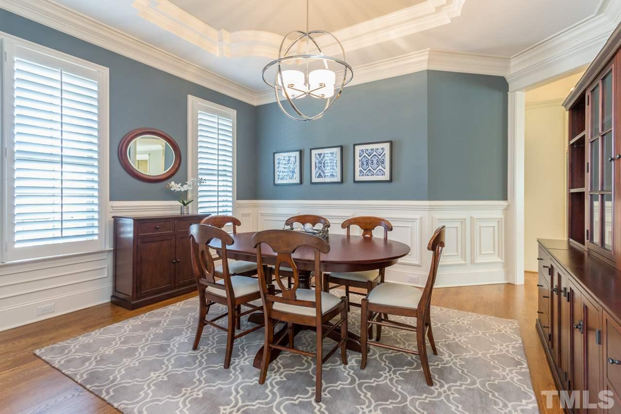 5012 Pomfret Point Raleigh, NC 27612 - Photo 3 of 25 The lovely dining room offers rich wainscoting, crown molding,and an intricate trey ceiling that is a work of art. Additional features include a sparkling chrome light fixture, plantation blinds and hardwood floors.