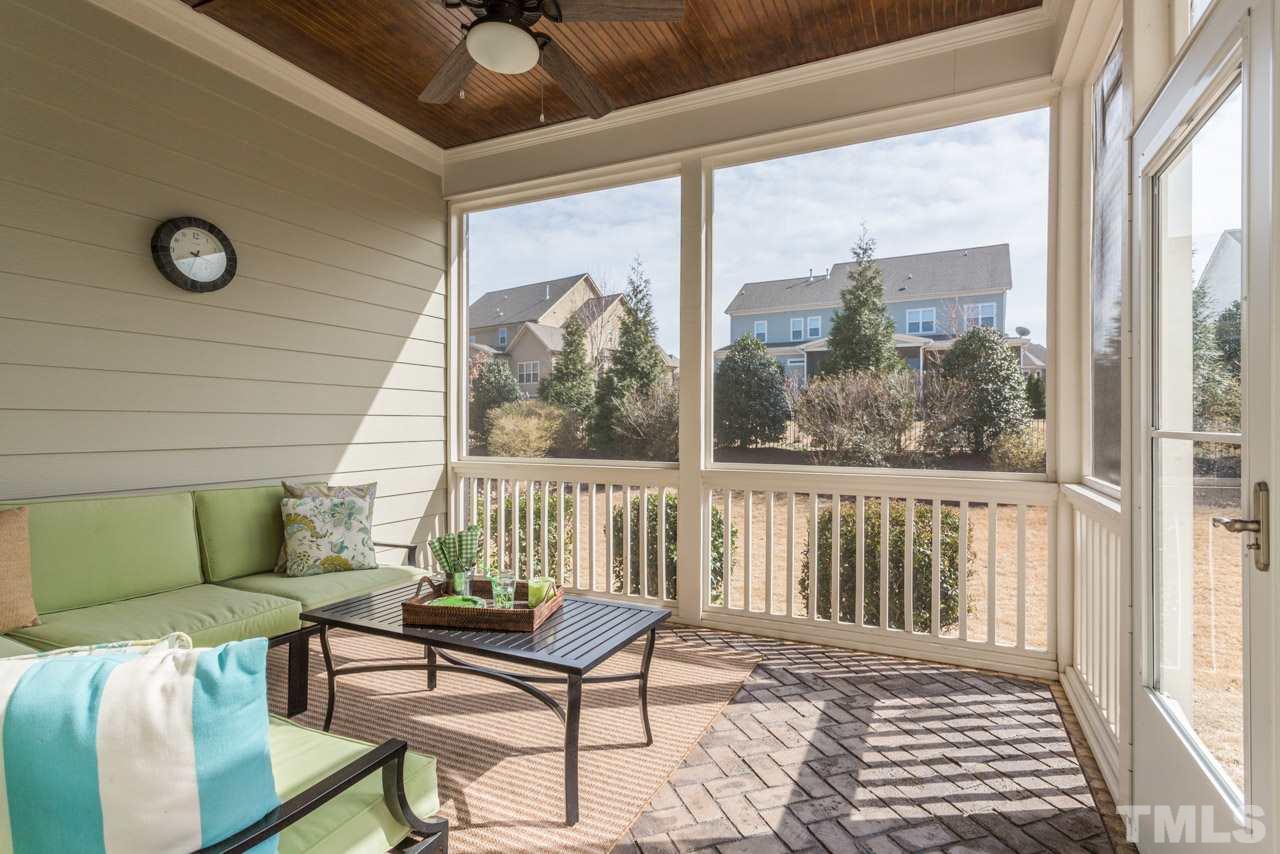 5012 Pomfret Point Raleigh, NC 27612 - Photo 22 of 25 Screen porch is off the breakfast room and features a stained bead-board ceiling and a ceiling fan