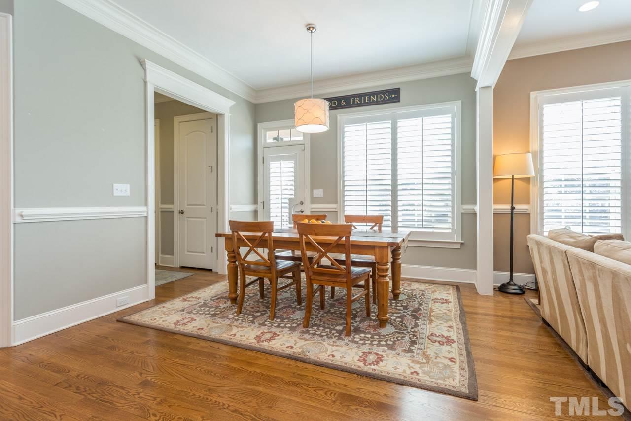 5012 Pomfret Point Raleigh, NC 27612 - Photo 9 of 25 The breakfast room offers hardwood floors, plantation shutters, crown molding and chair railing and is perfect for a farmhouse table!