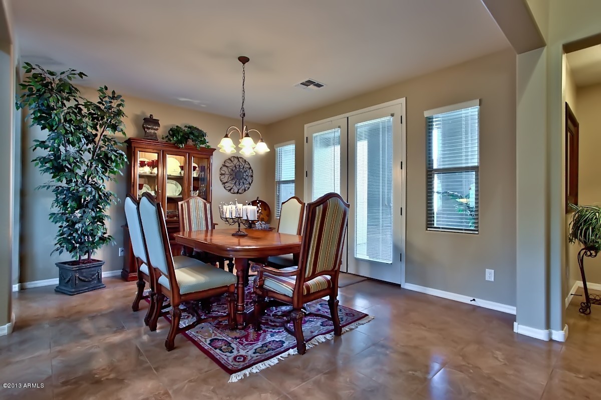 16147 West Granada Road Goodyear, AZ 85395 - Photo 2 of 34 Formal Dining w/ Doors to Courtyard