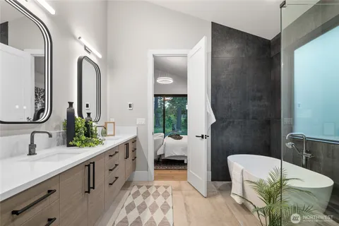 a bathroom with a double vanity sink and a mirror