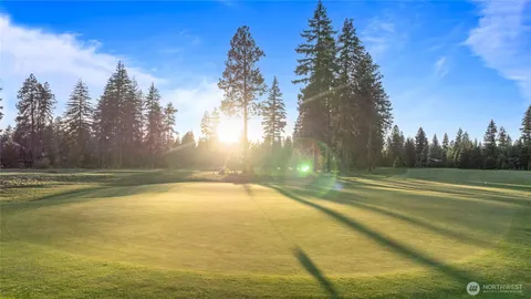 a view of a swimming pool with an outdoor space and seating area