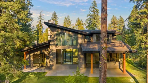 a view of a house with large trees