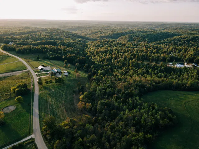 an aerial view of a golf course with parking space