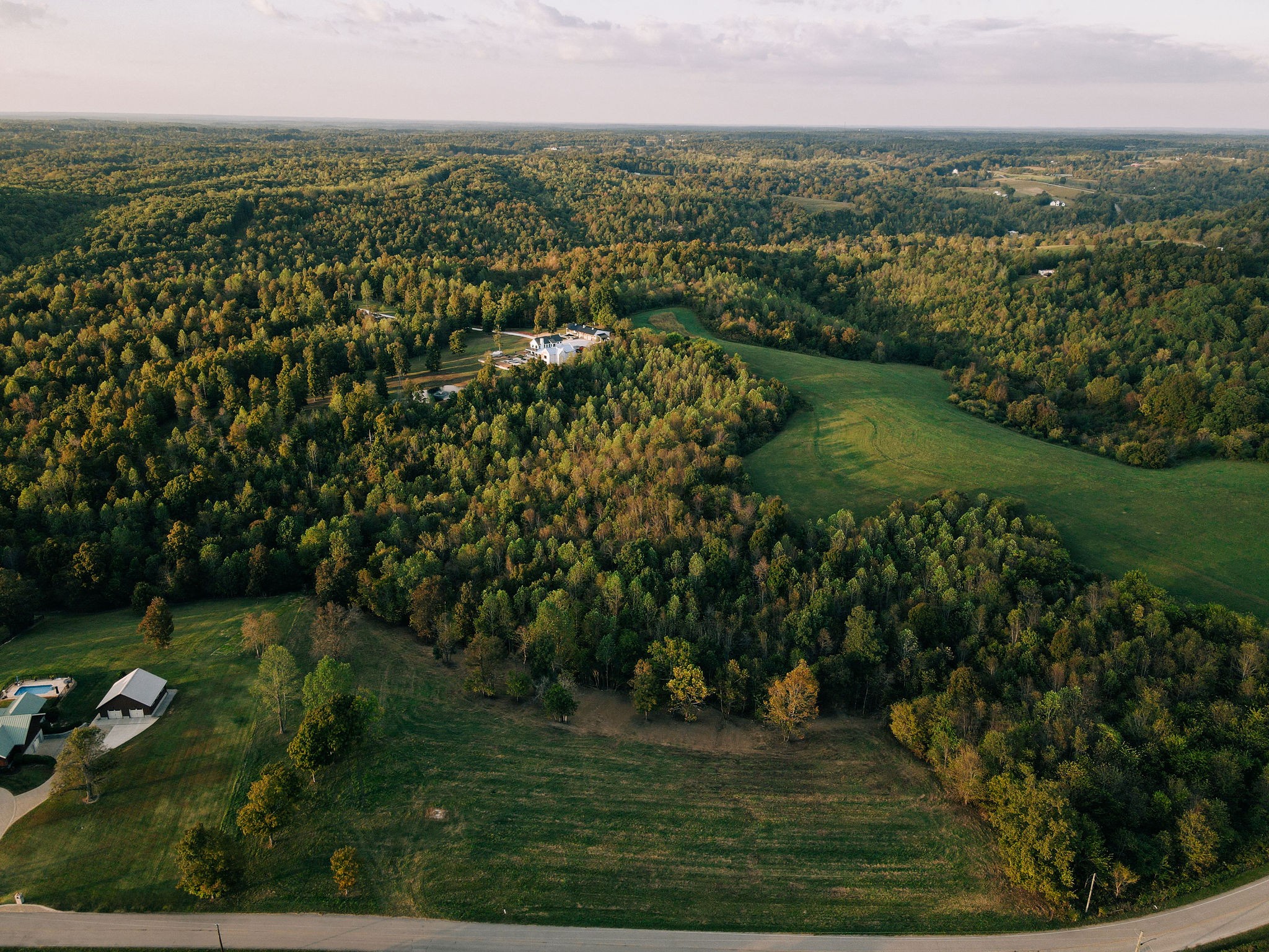 7810 West Lick Creek Road Primm Springs, TN 38476 - Photo 14 of 39 an aerial view of residential houses with outdoor space and trees