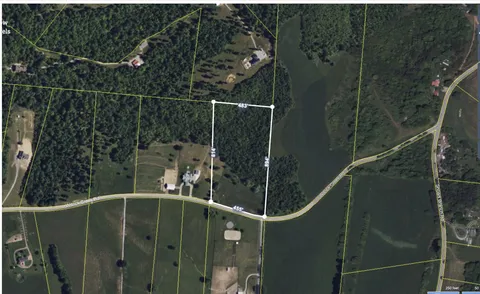 a view of a golf course with chairs