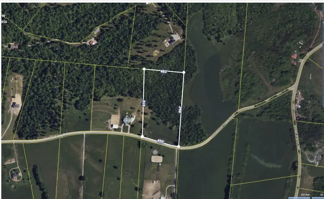 a view of a golf course with chairs