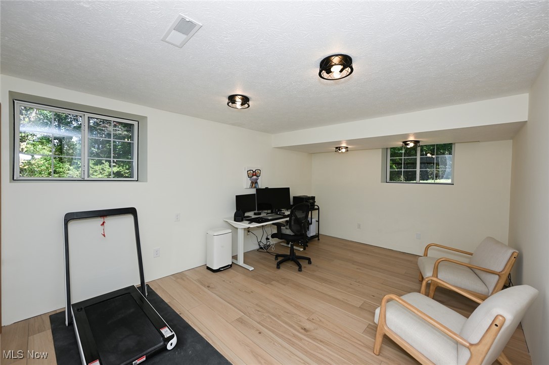 4845 State Road Medina, OH 44256 - Photo 31 of 47 Home office featuring light wood-style flooring and a textured ceiling
