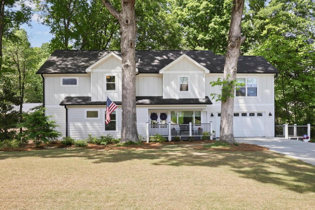 2864 North Thompson Road Northeast Brookhaven, GA 30319 - Photo 1 of 1 a front view of a house with a yard