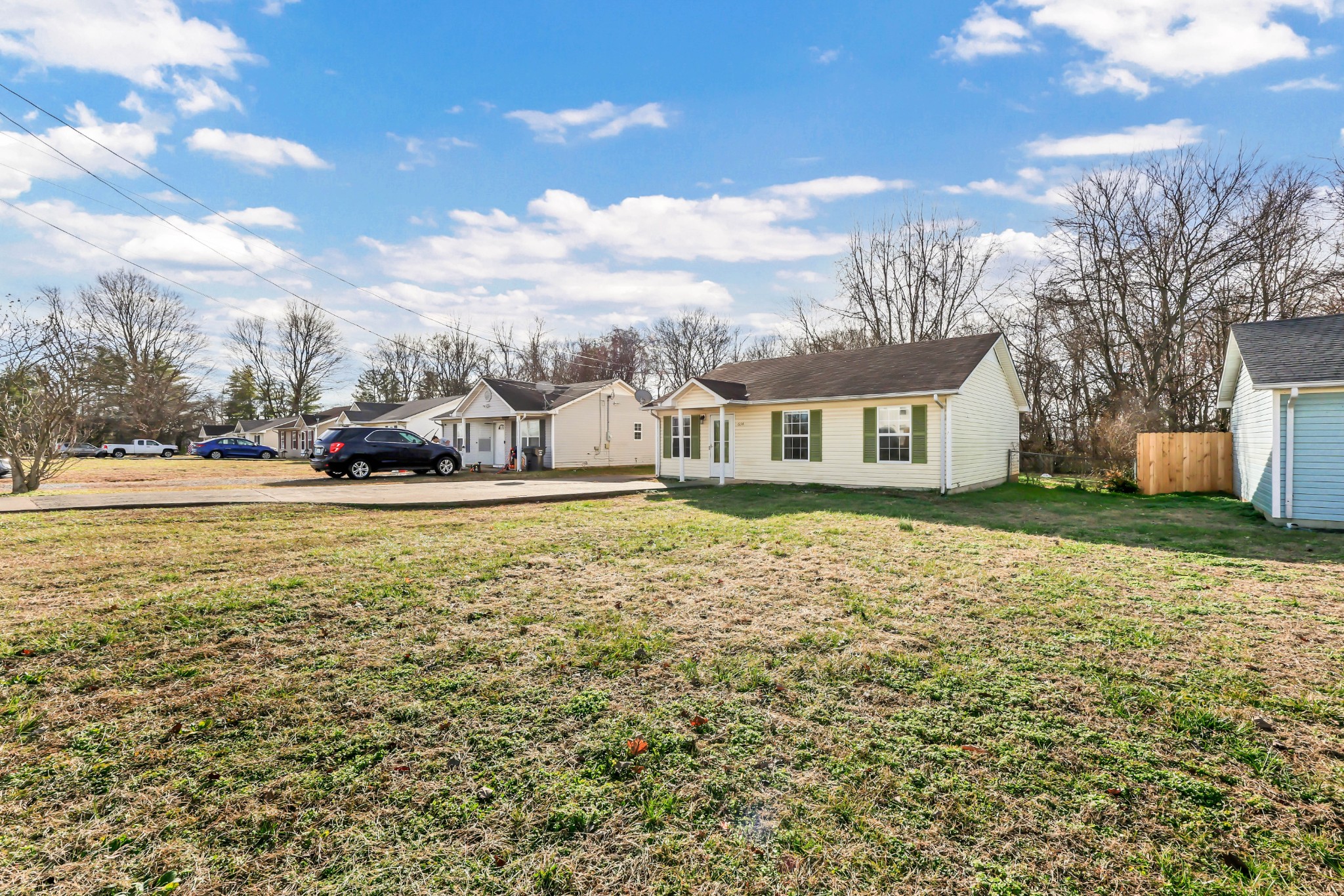 634 State Line Road Oak Grove, KY 42262 - Photo 2 of 17 a house view with swimming pool and trees in the background