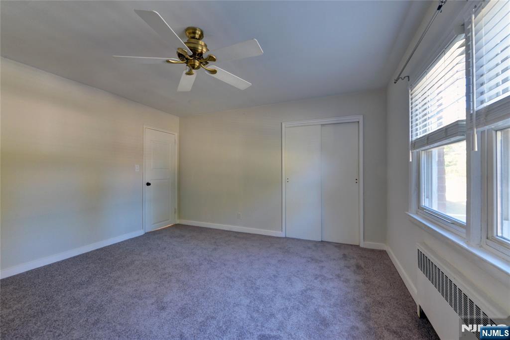 255 Bogert Road, Unit 2A River Edge, NJ 07661 - Photo 12 of 25 a view of an empty room with a window