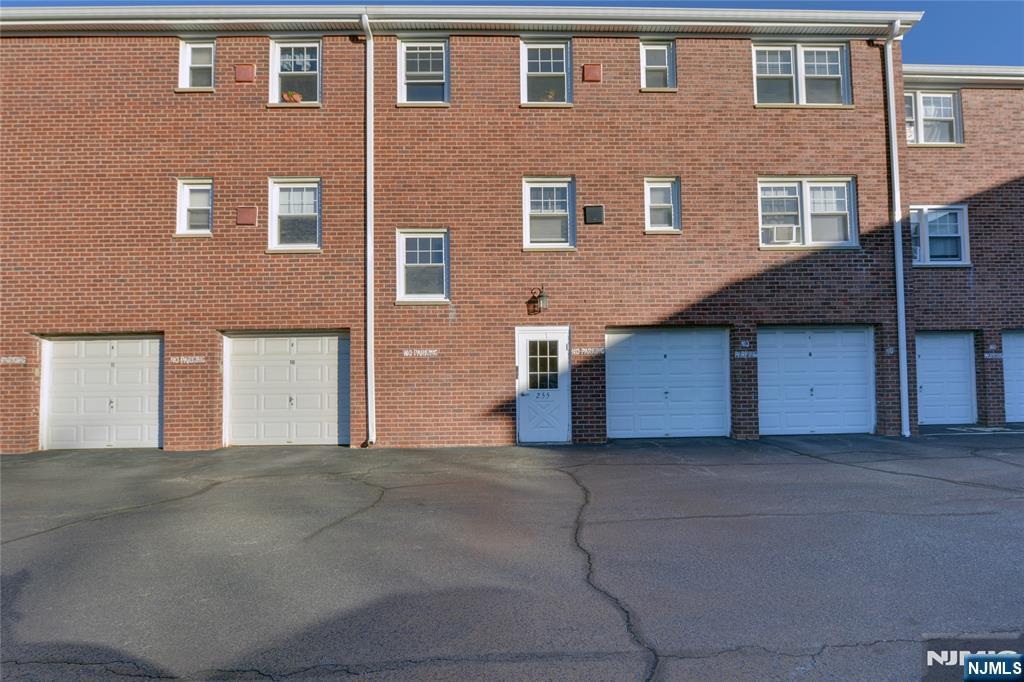 255 Bogert Road, Unit 2A River Edge, NJ 07661 - Photo 23 of 25 a front view of a house with a garage