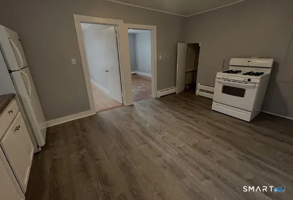 a view of kitchen and wooden floor