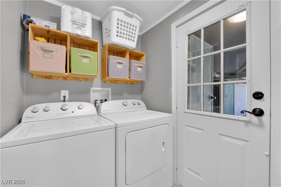 5550 Vicki Ann Road Pahrump, NV 89048 - Photo 28 of 44 Washroom featuring washer and dryer and ornamental molding