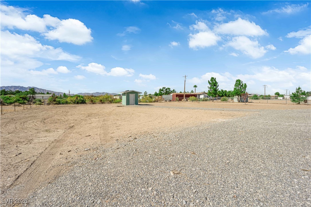 5550 Vicki Ann Road Pahrump, NV 89048 - Photo 5 of 44 View of yard with a storage shed and a view of rural / pastoral area