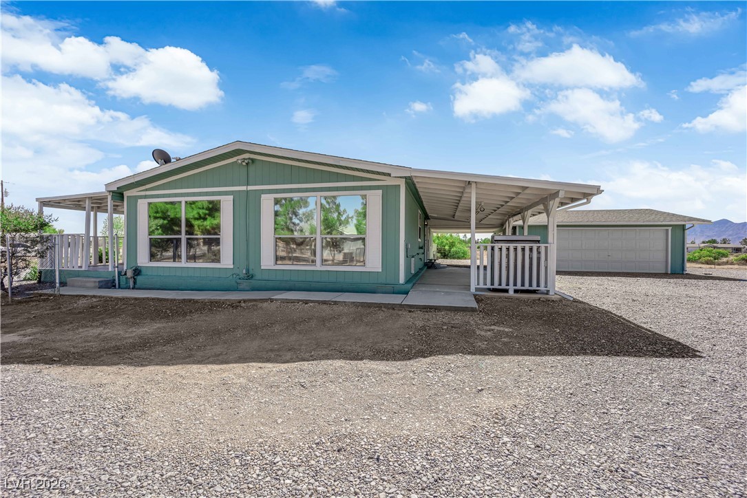5550 Vicki Ann Road Pahrump, NV 89048 - Photo 10 of 44 Rear view of property with a garage
