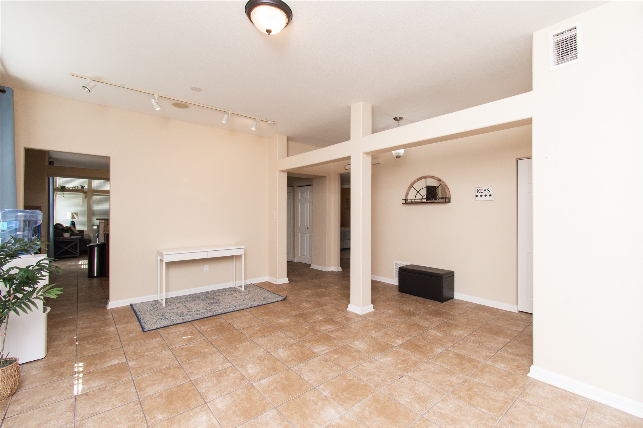421 Shadow Point San Marcos, TX 78666 - Photo 2 of 24 Unfurnished room with track lighting and light tile patterned flooring