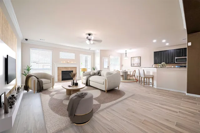 a living room with furniture and a fireplace