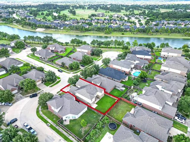 an aerial view of a city with lake view