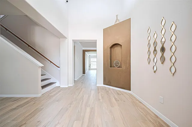 a view of a hallway view with staircase