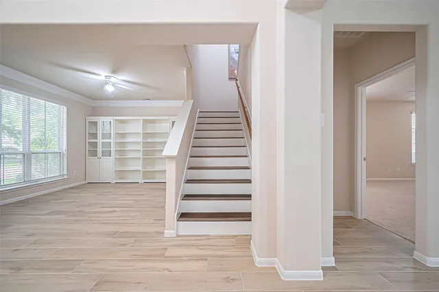 a view of an entryway with wooden floor and door