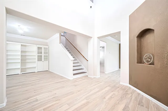 a view of an entryway with wooden floor