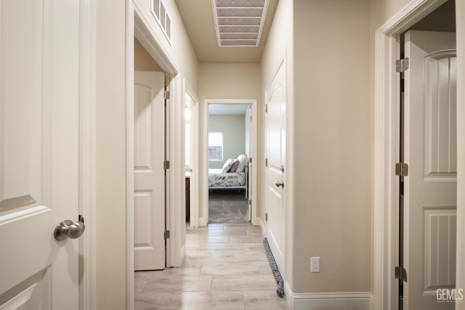 Undisclosed Address Shafter, CA 93263 - Photo 15 of 28 a view of a hallway with a livingroom and a bathroom
