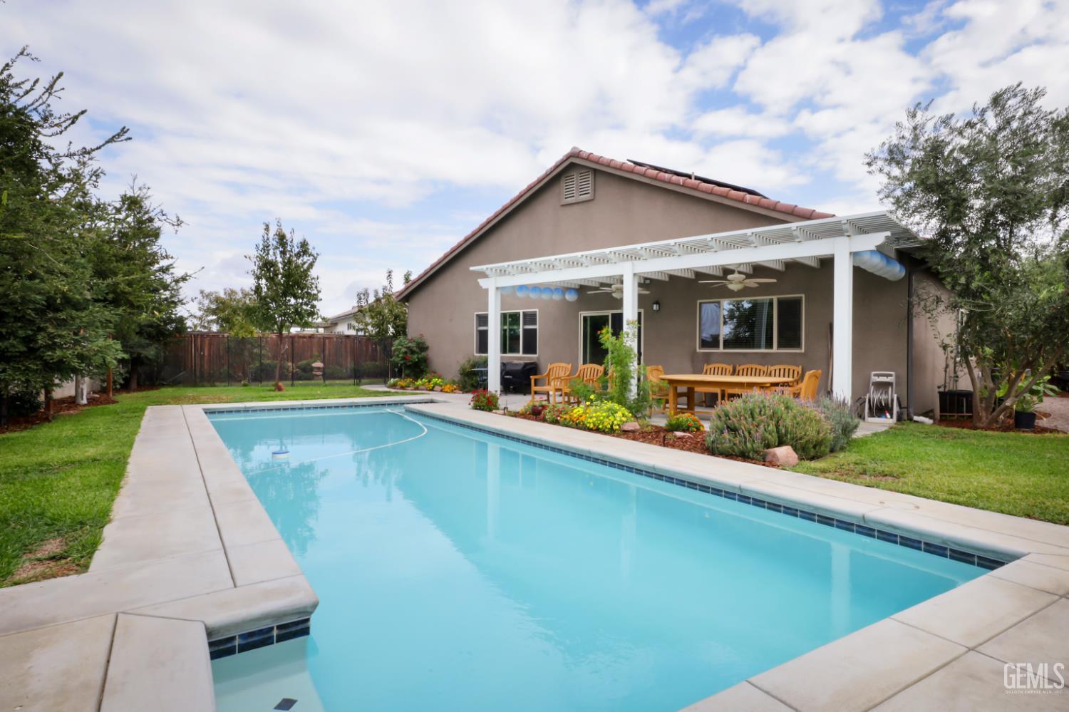Undisclosed Address Shafter, CA 93263 - Photo 25 of 28 a view of house with swimming pool and a yard
