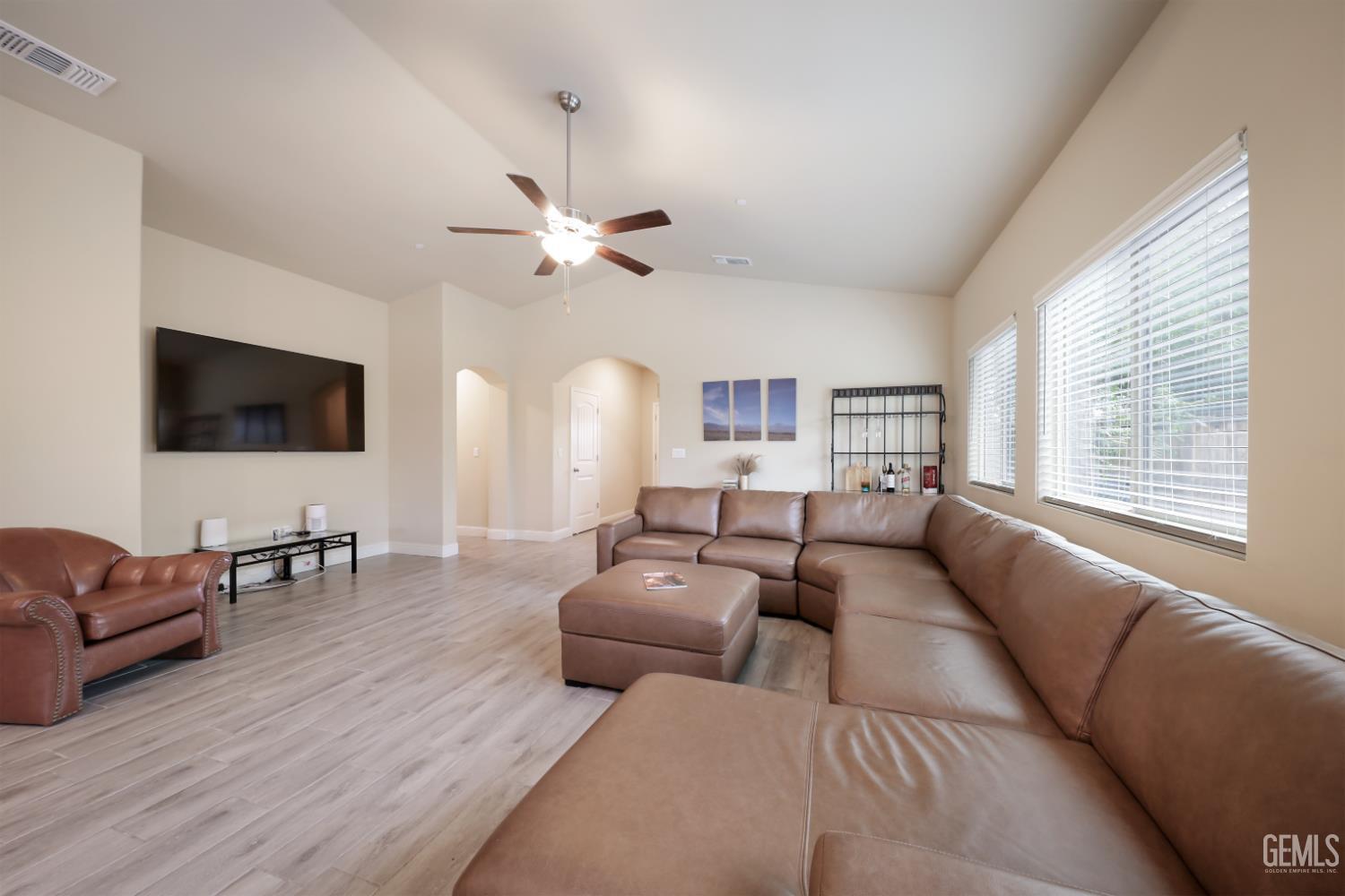 Undisclosed Address Shafter, CA 93263 - Photo 8 of 28 a living room with furniture and a flat screen tv
