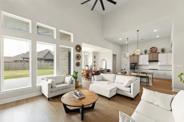 a living room with furniture and wooden floor