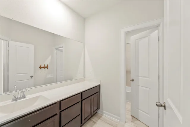 a bathroom with a shower and a tub