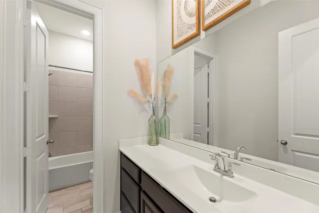 a bathroom with a bathtub and shower