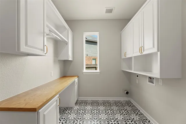 a living room with furniture a fireplace and a floor to ceiling window
