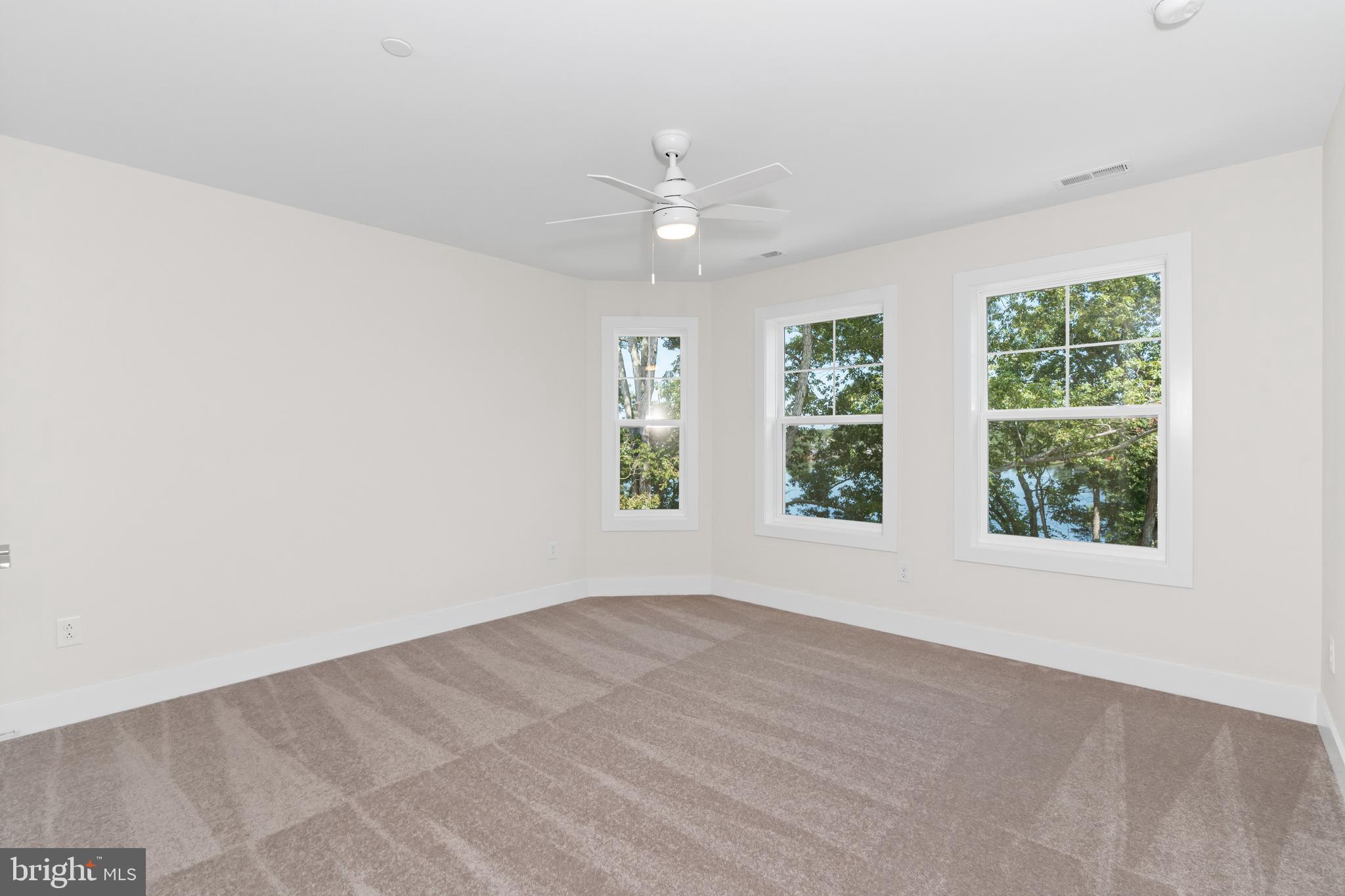 22580 Hummingbird Road, Unit 17 Ellendale, DE 19941 - Photo 14 of 75 an empty room with windows and closet