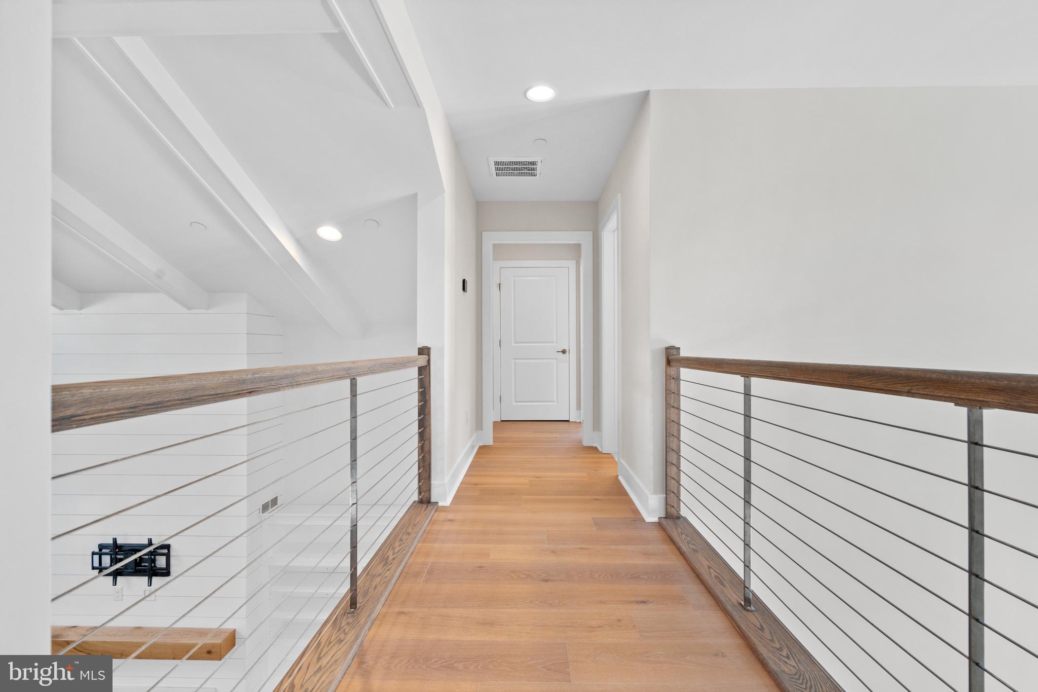 22580 Hummingbird Road, Unit 17 Ellendale, DE 19941 - Photo 18 of 75 a view of a hallway with wooden floor