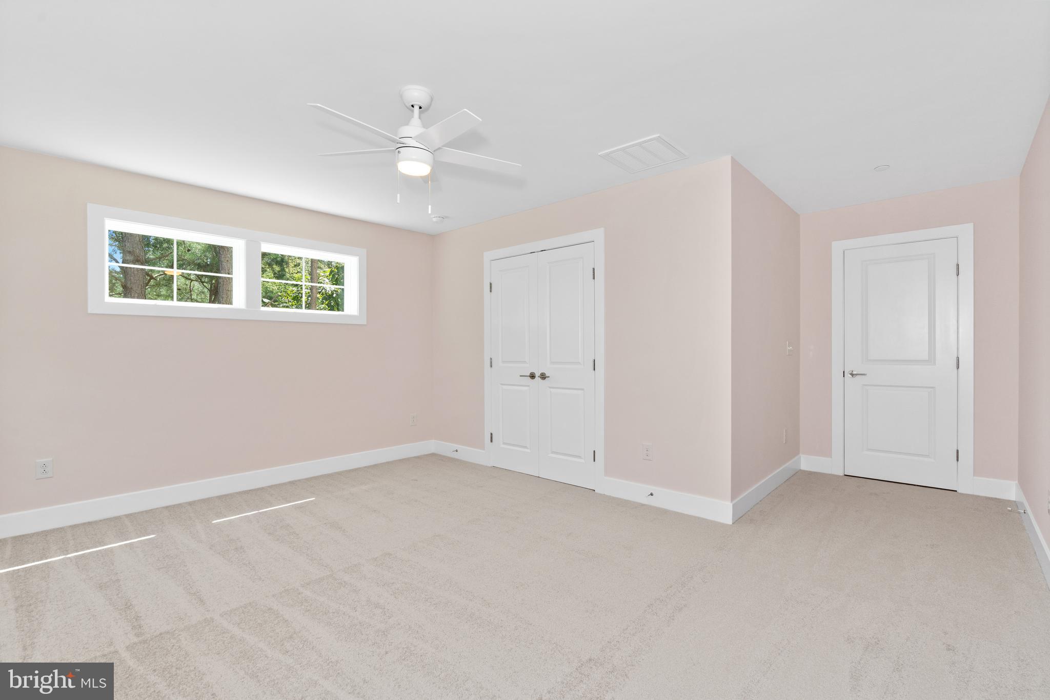 22580 Hummingbird Road, Unit 17 Ellendale, DE 19941 - Photo 22 of 75 a view of an empty room with a window